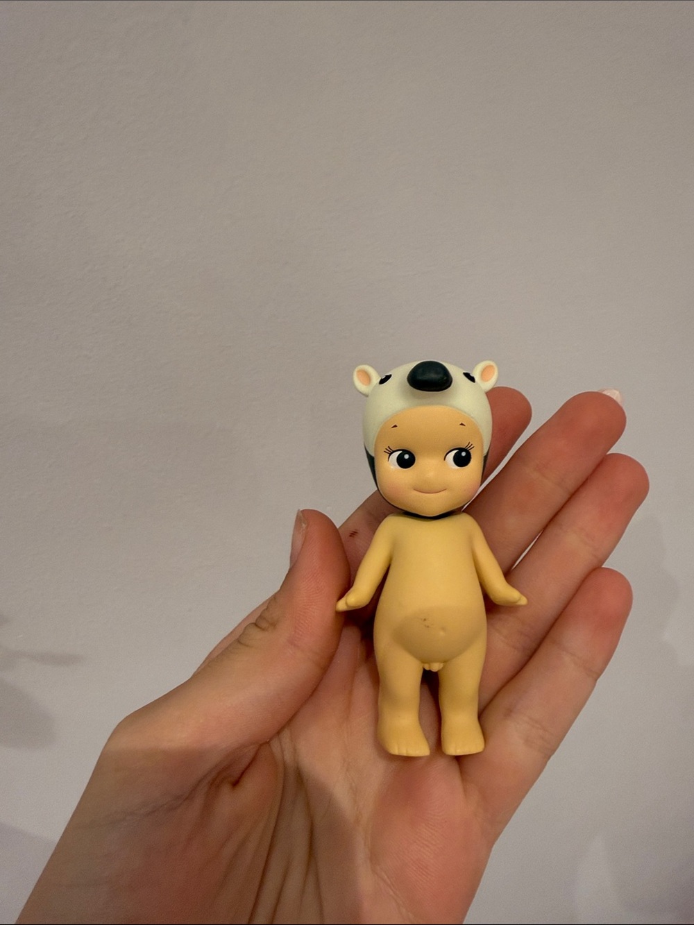 Cute Nude Baby Doll Figurine with White Animal Hat - Collectible Kids Toy